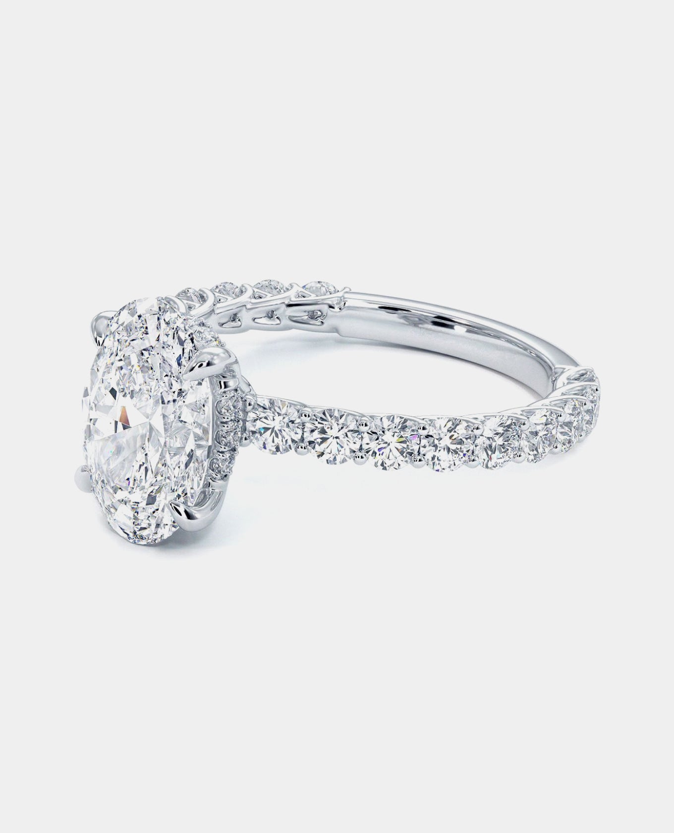 oval melody engagement ring